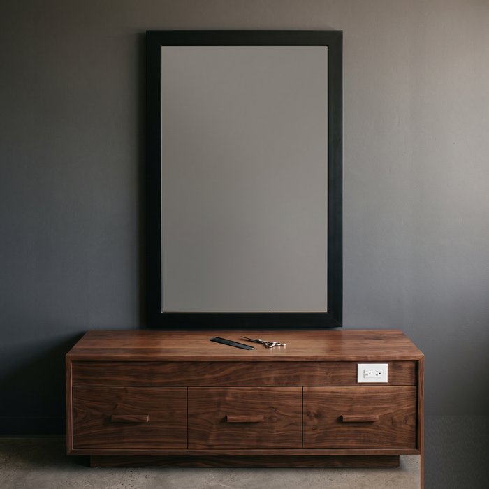 Barber styling station with framed mirror and drawers