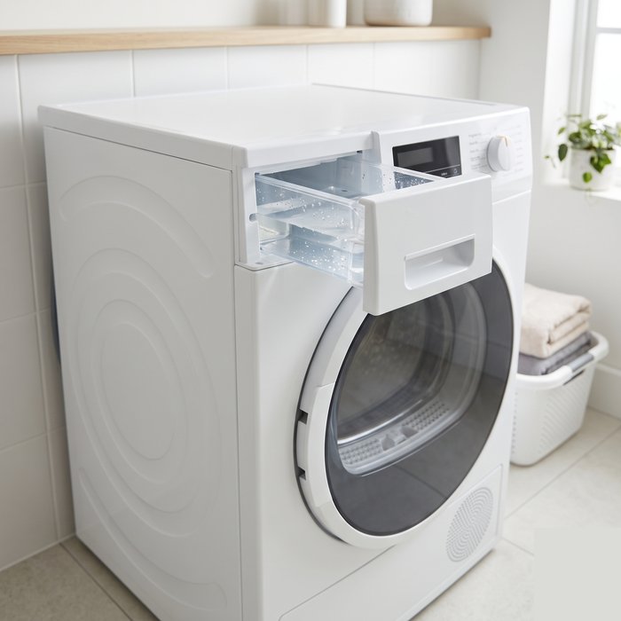 Condenser dryer with the water tank drawer pulled open